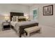 Comfortable bedroom with mirrored nightstands, stylish lamps, and a large dark wood bed with neutral accents at 3467 Brookleigh Ne Ln, Atlanta, GA 30319