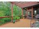 Inviting outdoor deck area with covered pergola, ceiling fan, and a screened-in porch for relaxation at 3467 Brookleigh Ne Ln, Atlanta, GA 30319