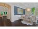 Elegant dining room featuring dark hardwood floors, modern lighting, and stylish decor at 3467 Brookleigh Ne Ln, Atlanta, GA 30319