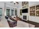 Cozy living room with a stone fireplace, built-in shelving, and comfortable seating at 3467 Brookleigh Ne Ln, Atlanta, GA 30319
