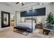 This stylish main bedroom features a canopy bed, tray ceilings, an ensuite bathroom, and a sitting area at 3467 Brookleigh Ne Ln, Atlanta, GA 30319