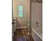 Bathroom featuring a tub, granite counters, and a window with a view at 400 Old Stagecoach Rd, Carrollton, GA 30116