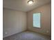 Bedroom featuring a carpet floor, neutral colored walls, and a window with blinds at 400 Old Stagecoach Rd, Carrollton, GA 30116