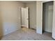 Neutral bedroom featuring carpet flooring, gray painted walls and a large closet for plenty of storage at 400 Old Stagecoach Rd, Carrollton, GA 30116