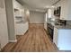 Kitchen displays stainless steel appliances, granite countertops, and white cabinets with wood floors at 400 Old Stagecoach Rd, Carrollton, GA 30116