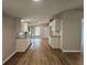 Bright kitchen featuring wood floors, white cabinets, granite countertops, and stainless steel appliances at 400 Old Stagecoach Rd, Carrollton, GA 30116
