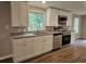 Modern kitchen showcases stainless steel appliances, granite countertops, and white cabinetry at 400 Old Stagecoach Rd, Carrollton, GA 30116