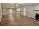Spacious living area with wood flooring, fireplace, and open layout to the kitchen at 400 Old Stagecoach Rd, Carrollton, GA 30116