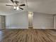 Living room with vaulted ceilings, wood-look floors, and neutral colored walls at 400 Old Stagecoach Rd, Carrollton, GA 30116