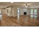 Open-concept living space with wood floors, fireplace, and access to a private patio at 400 Old Stagecoach Rd, Carrollton, GA 30116