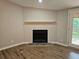 Living room showcases a cozy fireplace and access to the outdoor deck at 400 Old Stagecoach Rd, Carrollton, GA 30116