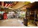 Bright basement with an assortment of tools and equipment, offering space for storage and workshop activities at 5642 N Highway 212, Covington, GA 30016