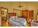 Bedroom featuring natural light, hardwood floors, a large window, and a wooden wardrobe at 5642 N Highway 212, Covington, GA 30016