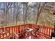 Enjoy outdoor relaxation on this spacious deck, surrounded by lush greenery and mature trees at 5642 N Highway 212, Covington, GA 30016