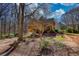 Beautiful home with mature trees and manicured landscaping at 5642 N Highway 212, Covington, GA 30016