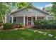 Charming home with a welcoming front porch, manicured lawn, and classic architectural details at 22 Peachtree Hills Ne Ave, Atlanta, GA 30305