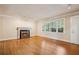 Bright and airy living room with a fireplace, large windows, and hardwood floors at 22 Peachtree Hills Ne Ave, Atlanta, GA 30305