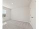 Bright bedroom with neutral carpet, a window, and a closet at 2625 Mourning Dove Dr (Lot 47), Grayson, GA 30017