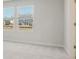 Bedroom view with neutral carpet and window views of the neighborhood at 2625 Mourning Dove Dr (Lot 47), Grayson, GA 30017