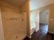 Bathroom featuring a tub, shower, and doorway view of main bedroom at 312 Yarbrough Ct, Dacula, GA 30019