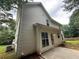 Back exterior of a two-story home with a small patio at 312 Yarbrough Ct, Dacula, GA 30019