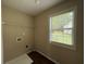 Laundry room with window and overhead shelf at 312 Yarbrough Ct, Dacula, GA 30019
