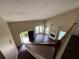 An aerial view of a living room with a fireplace and large windows at 312 Yarbrough Ct, Dacula, GA 30019