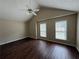 Spacious main bedroom with vaulted ceilings, neutral walls, wood flooring and natural light at 312 Yarbrough Ct, Dacula, GA 30019