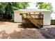 View of backyard featuring stairs to deck and white painted exterior at 495 Hascall Nw Rd, Atlanta, GA 30309