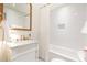 Bright bathroom featuring subway tile, a marble vanity, and modern fixtures at 495 Hascall Nw Rd, Atlanta, GA 30309