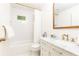 Elegant bathroom featuring subway tile, a marble vanity, and gold fixtures at 495 Hascall Nw Rd, Atlanta, GA 30309