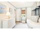 Cozy bedroom with a daybed, white dresser, blue accents, and charming decor at 495 Hascall Nw Rd, Atlanta, GA 30309