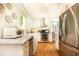 Spacious kitchen with stainless steel appliances, marble countertops, and hardwood floors at 495 Hascall Nw Rd, Atlanta, GA 30309