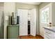 View of kitchen storage with an adjacent door and marble countertops at 495 Hascall Nw Rd, Atlanta, GA 30309