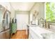 Stylish kitchen with stainless steel refrigerator, marble countertops, and farmhouse sink at 495 Hascall Nw Rd, Atlanta, GA 30309