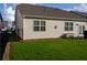 Spacious backyard with green grass and black fencing, offering privacy and room for outdoor activities at 513 Forest Ln, Canton, GA 30114