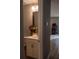 Half bath featuring a vanity with fresh flowers and an adjacent game room at 513 Forest Ln, Canton, GA 30114