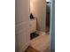 Tiled bathroom featuring a walk-in shower and a cabinet at 513 Forest Ln, Canton, GA 30114