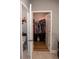 Powder room with toilet, tile floor, and access to closet at 513 Forest Ln, Canton, GA 30114