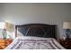 Bedroom featuring a comfortable bed and matching nightstands, illuminated by bedside lamps at 513 Forest Ln, Canton, GA 30114