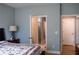 Open doorway from the bedroom leads into an attached bathroom at 513 Forest Ln, Canton, GA 30114