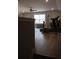 Bright bonus room with hardwood floors, exercise equipment, and a ceiling fan at 513 Forest Ln, Canton, GA 30114