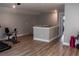 Spacious bonus room featuring an exercise bike and access to another room at 513 Forest Ln, Canton, GA 30114