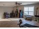 Bonus room with grey walls, hardwood floors, and a window with blinds at 513 Forest Ln, Canton, GA 30114