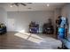 Spacious bonus room with hardwood floors, ceiling fan, recessed lighting, and ample space for activities at 513 Forest Ln, Canton, GA 30114