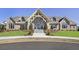 Community clubhouse with stone and siding exterior, landscaped grounds, and accessible entrance at 513 Forest Ln, Canton, GA 30114