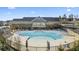 Resort-style community pool with a spacious deck, lounge chairs, and clubhouse in the background at 513 Forest Ln, Canton, GA 30114