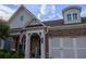 Close up of the front of the home showing a stone facade and a welcoming front porch at 513 Forest Ln, Canton, GA 30114