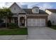 Charming home features a stone and brick facade, two-car garage, and a welcoming front porch at 513 Forest Ln, Canton, GA 30114