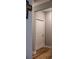 Hallway corner with light paint, white trim, and attractive wood flooring at 513 Forest Ln, Canton, GA 30114